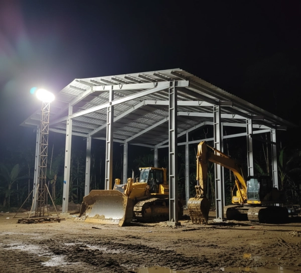 Construction of heavy equipment workshop steel frame at the mining site.